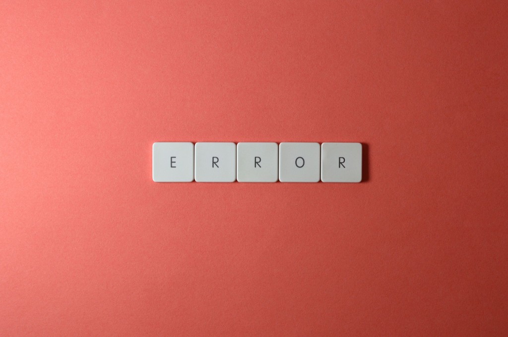 When AI Gets It Wrong article cover: white letter tiles spelling ERROR on a red background